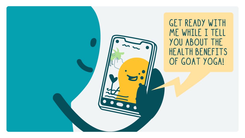 A doodle watches a video on their phone with an influencer saying, "Get ready with my while I tell you about the health benefits of goat yoga!