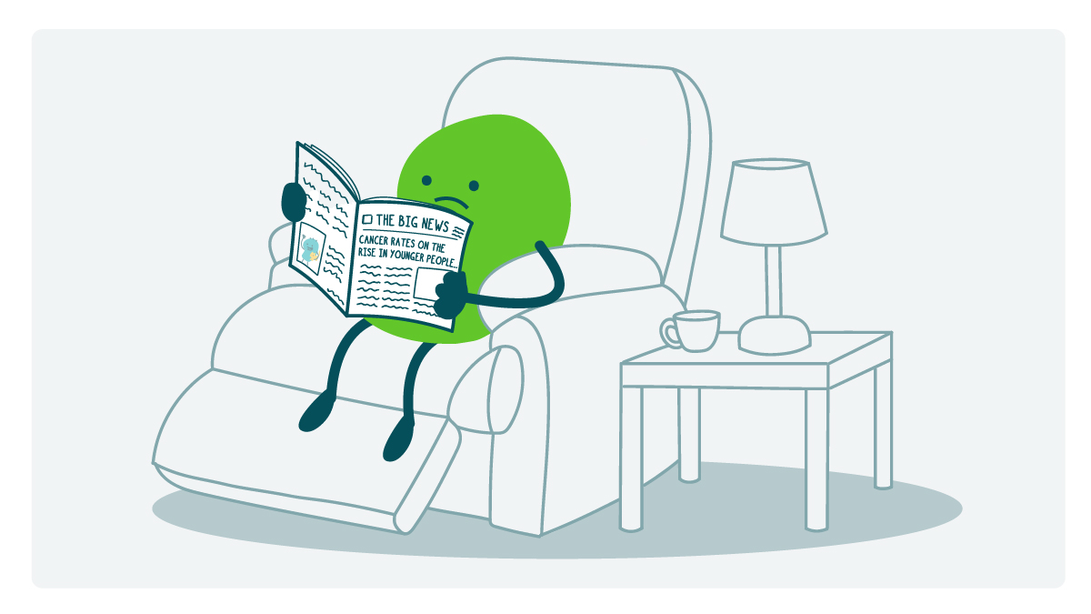 A doodle sits in an easy chair reading a news magazine with the headline Cancer Rates on the Rise in Younger People.